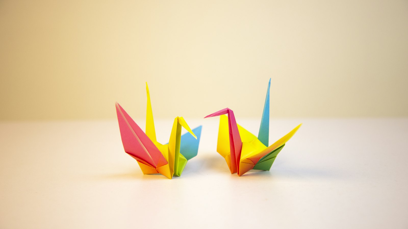 two yellow-red-blue papers