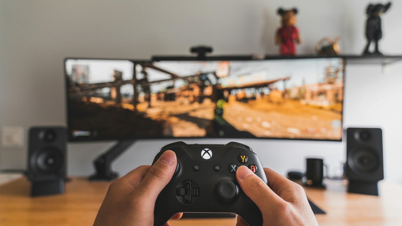 person holding black game controller