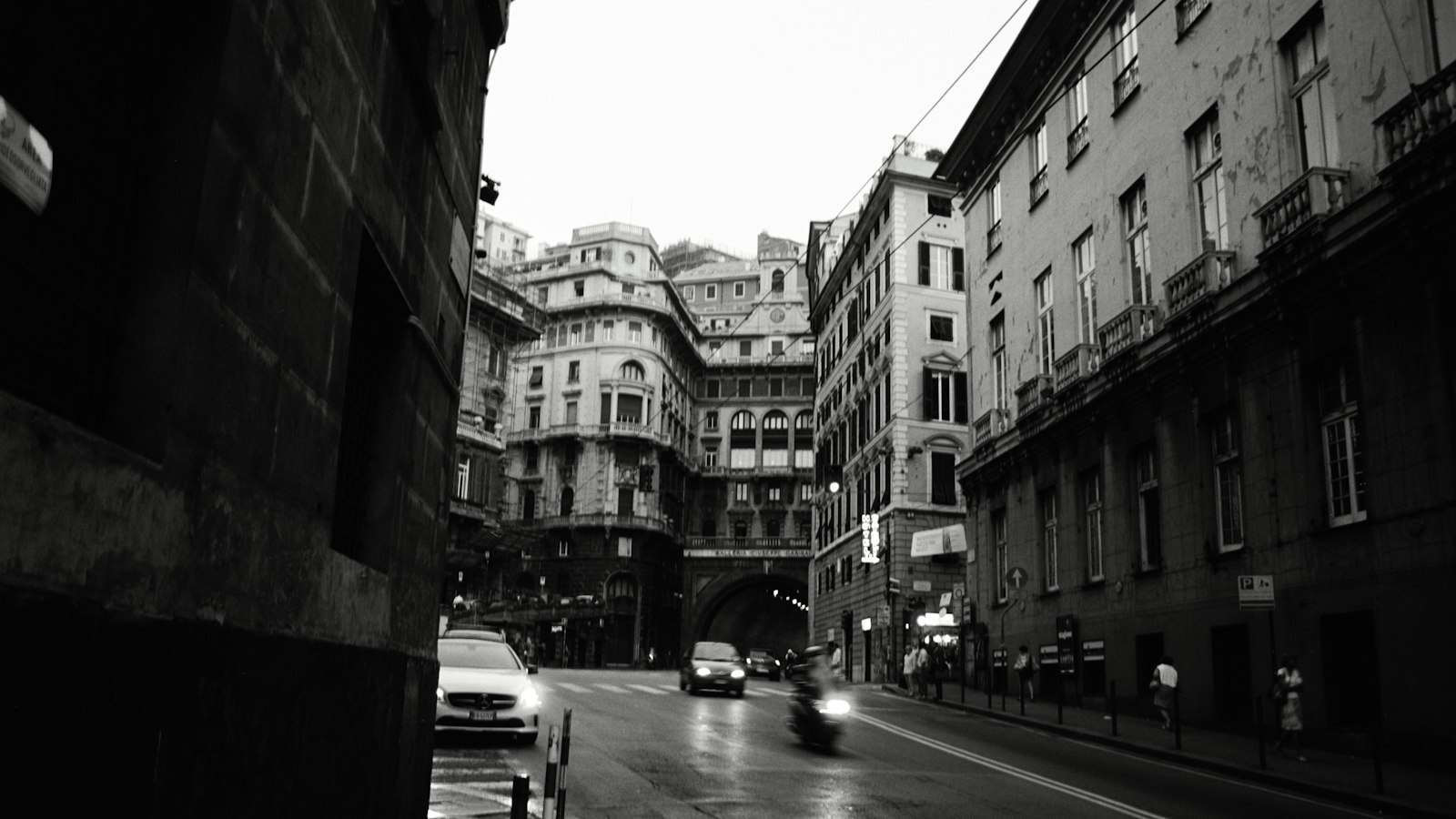 Wet street in a european city with historic buildings
