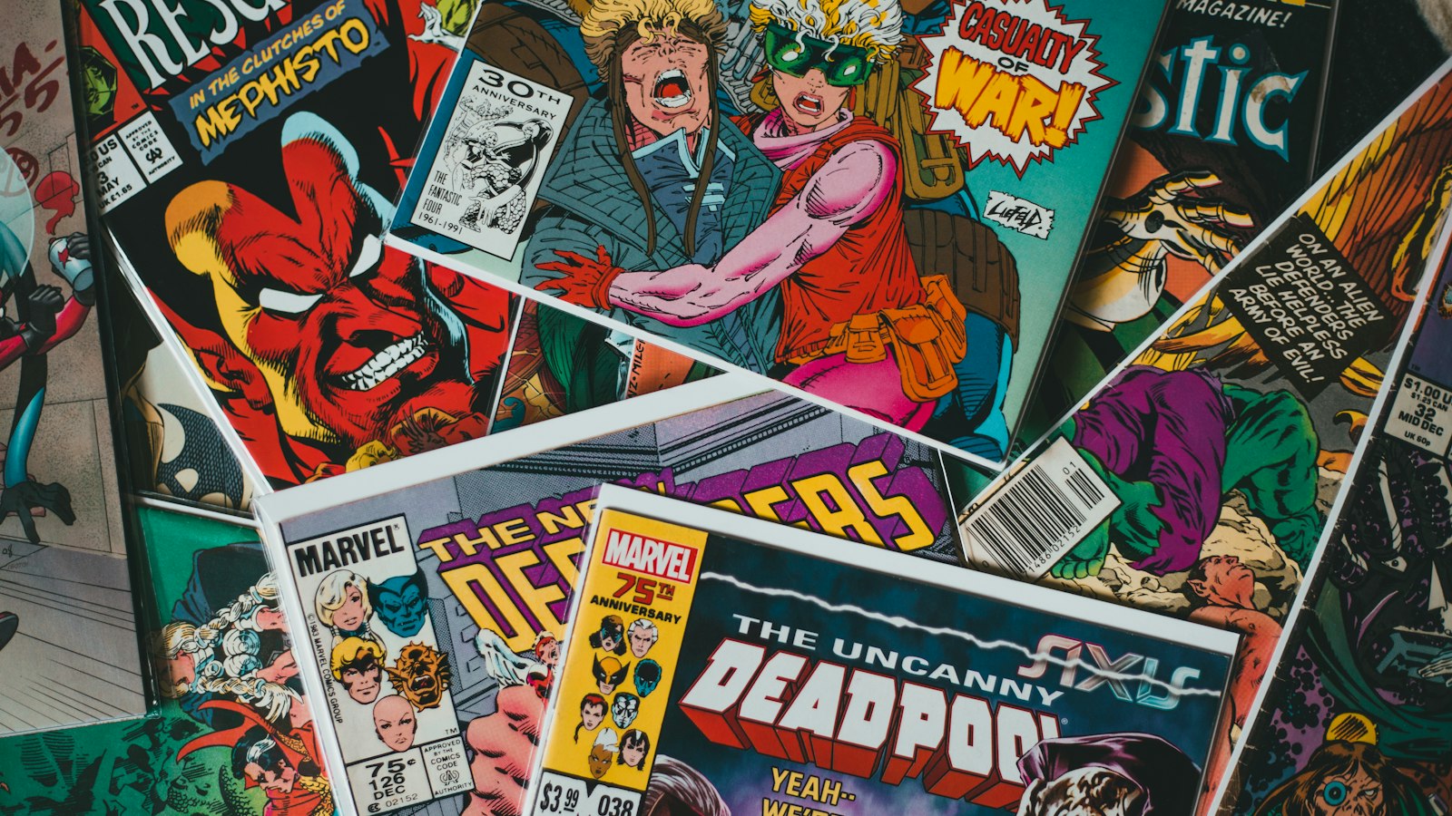A collection of vintage Marvel comic books overlapping on a flat surface
