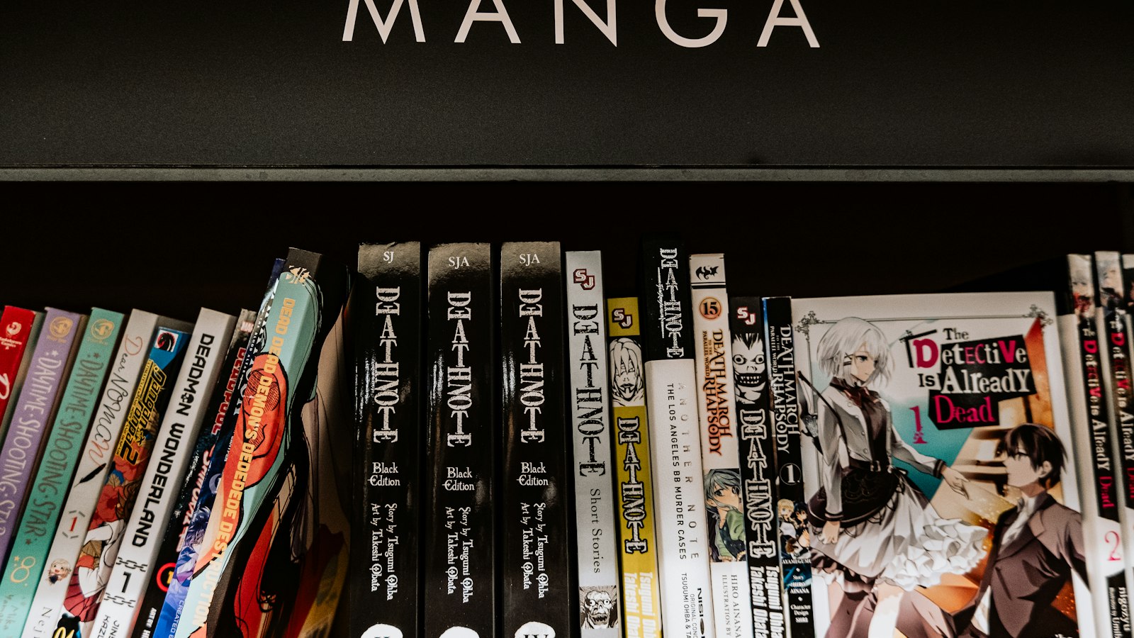 a bunch of books that are on a shelf
